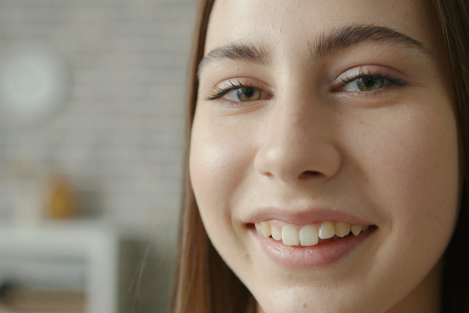 Woman with clear unretouched skin in natural daylight