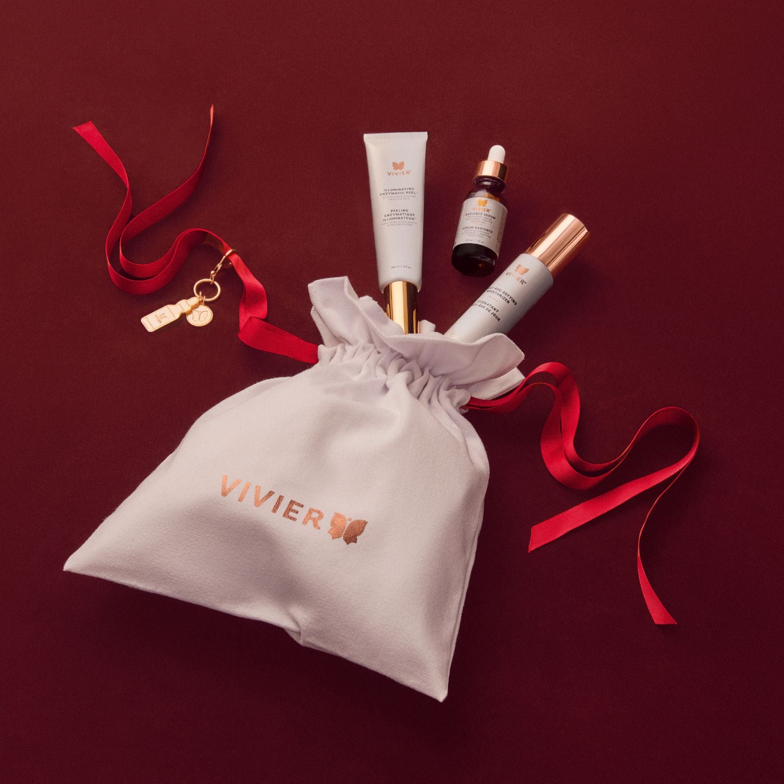 Vivier Radiance Renewal Gift Set flat lay with Illuminating Enzymatic Peel, Radiance Serum and Daily Age-Defying Moisturizer